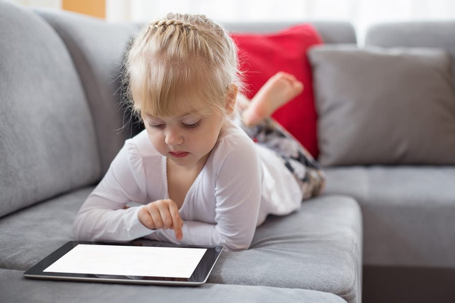 Young girl using tablet computer