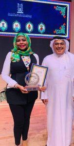 تكريم أمل الرندي في ملتقى <a class=